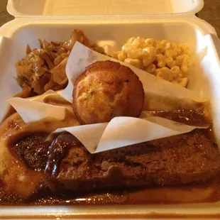 Meatloaf with mashed potatoes &amp; gravy! It comes with two sides (Mac &amp; cheese &amp; smothered cabbage) &amp; jalapeño corn bread!