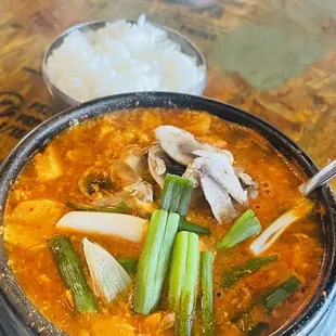 a bowl of soup and a plate of rice