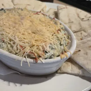 Spinach artichoke dip with pita triangles