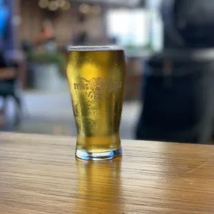 a pint of beer on a table