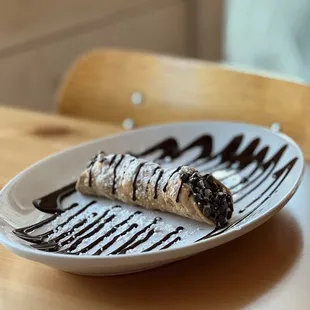 Cannoli (order came with three - we ate one while dining in and took the other two to go)!