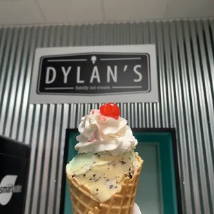A delicious Double scoop of chocolate chip and mint chip on a waffle cone!