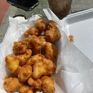 a tray of fried doughnuts