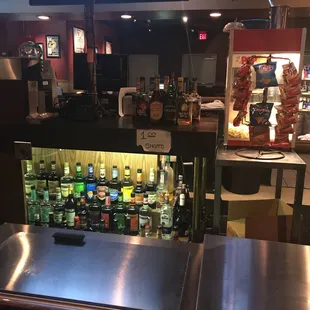 a bar with bottles of liquor
