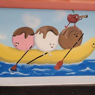 three ice cream sundaes in a banana boat