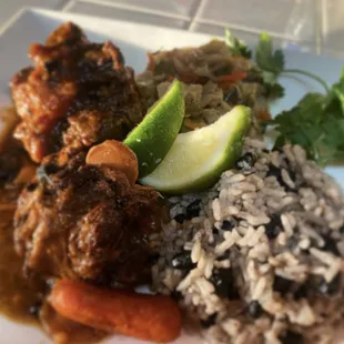 Dynamites Jamaican Oxtails with Jamaican rice n peas and Jamaican steamed cabbage