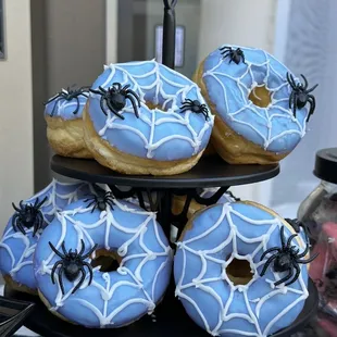 blue frosted donuts with spider webs
