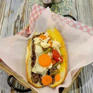a hot dog with various toppings