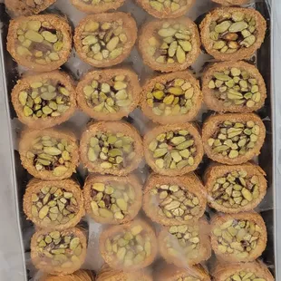 a tray of cookies with pistachios