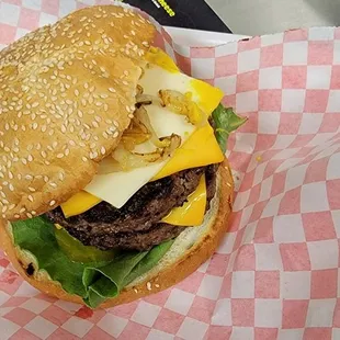a cheeseburger in a basket