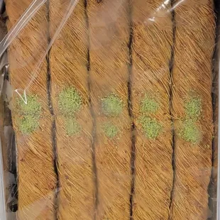 a tray of carrots wrapped in plastic