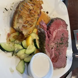 Prime rib with twice baked potato and veggies