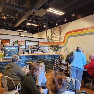 a group of people sitting at tables