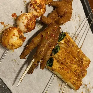 Quail eggs, chicken feet, mushroom wrapped veggies