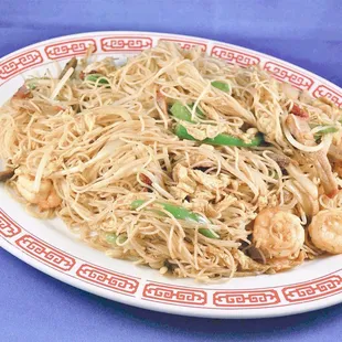 a plate of noodles and shrimp
