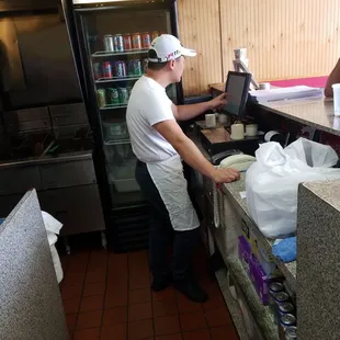 a woman working in a kitchen