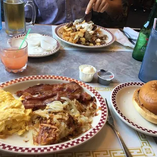 I had the one egg breakfast with bacon, hash browns, and a bagel and tequila sunrise. Across the table: Greek skillet.