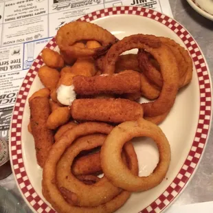 Combo platter with mozzarella sticks, onion rings, and cheese curds