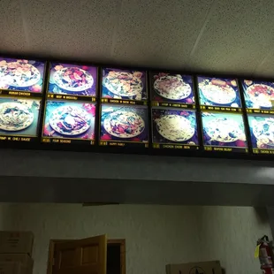 a restaurant menu with asian food on the wall