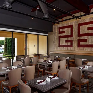 a dining room with tables and chairs