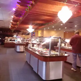 a man walking through a buffet