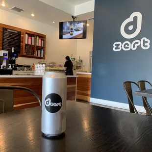 a coffee cup on a table in a coffee shop