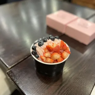 a bowl of strawberries and blueberries