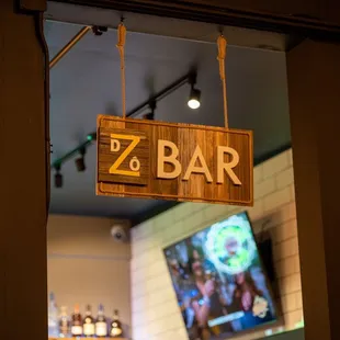 a sign hanging from the ceiling