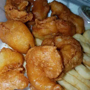 Fried jumbo shrimp and french fries.