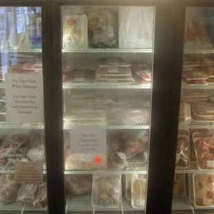Two large fully stocked coolers of meat.. from lamb to seafood.