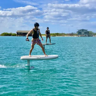 Brothers having a great time doing an eFoil lesson together
