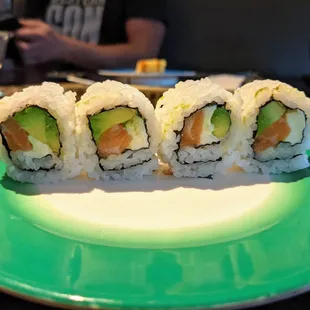 Salmon, avocado, and cream cheese sushi roll.