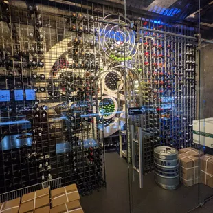 Inside. Wine / sake / alcoholic beverage bottle room with glass walls and door in the back.