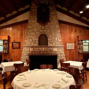 a dining room with a fireplace