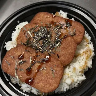 a plate of rice and meat