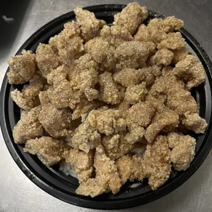Popcorn chicken over rice