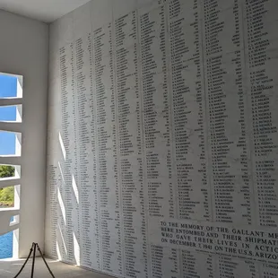 "Tree of Life" window design framing the memorial marble wall of remembered heros
