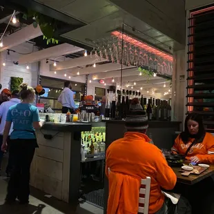 a group of people eating at a restaurant