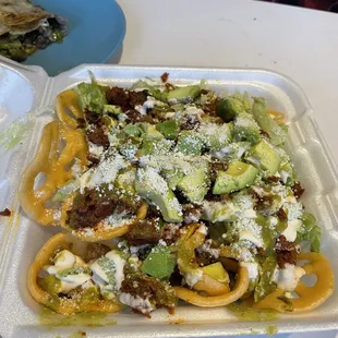 Chichinachos. I don't know they have them all the time but they were crunchy and tasty. Lots of avocado and queso with the al pastor.