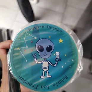 a person holding a frisbee in their hand