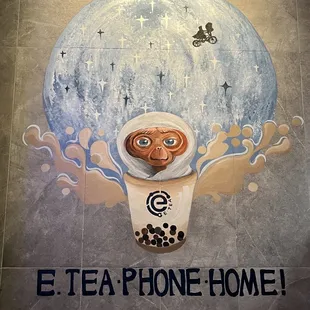 a cup of tea with a monkey on it