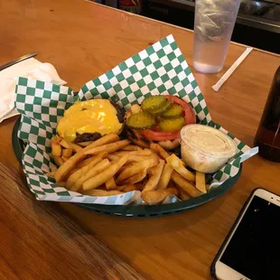 Cheeseburger with pickles and tomatoes