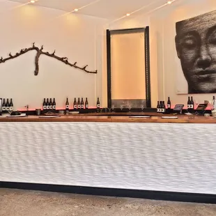 a bar with bottles of wine on it