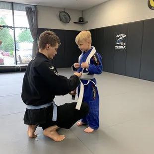 Brazilian Jiu-jitsu belt promotion kids class