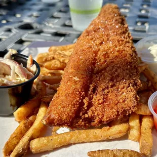 Fish and Chips of breaded walleye, french fries, Sriracha slaw, tartar