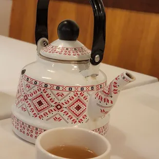 a teapot and a cup of tea