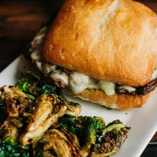 a burger and brussels sprouts