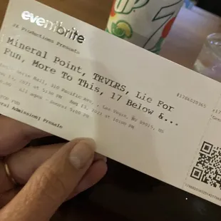 a person holding a ticket