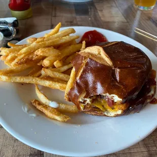 Burger with pretzel bun &amp; fries