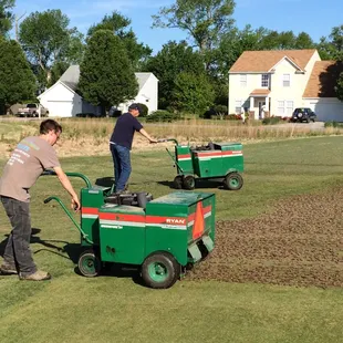 Maintenance Crew working on getting the greens ready for a great summer.